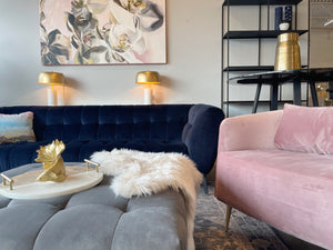 velvet modern sofa with pink velvet armchair and gold decor